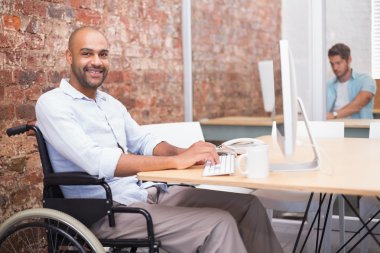 businessman in wheelchair working clipart