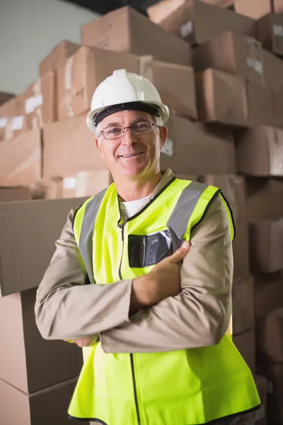 Worker standing in warehouse — Stock Photo, Image