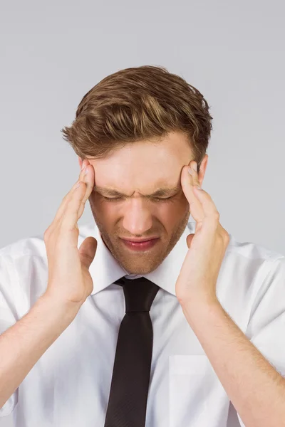 Businessman getting headache — Stock Photo, Image