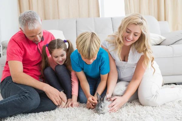 Family with pet bunny — Stock Photo, Image