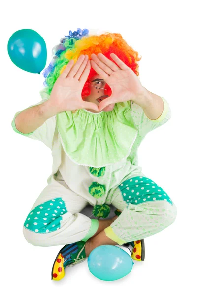 Clown umrahmt mit Händen — Stockfoto