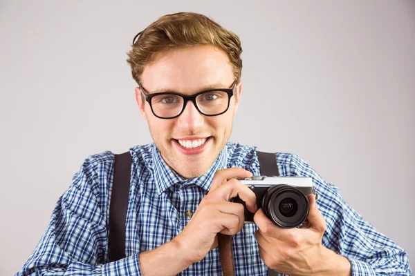 Hipster holding retro camera — Stock Photo, Image