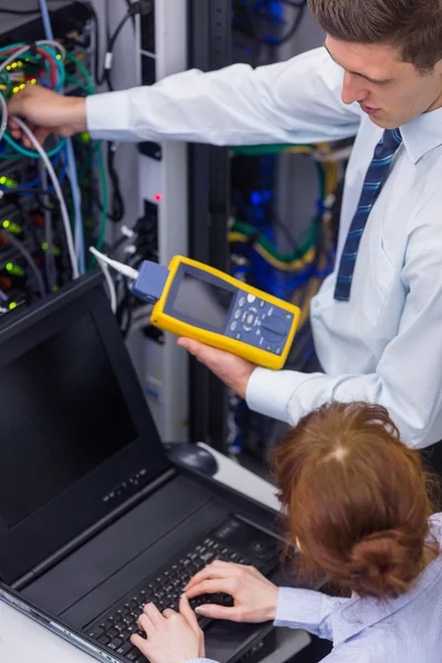 Technicians using digital cable analyser — Stock Photo, Image