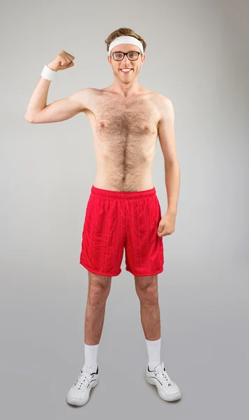 Hipster flexing bicep — Stock Photo, Image