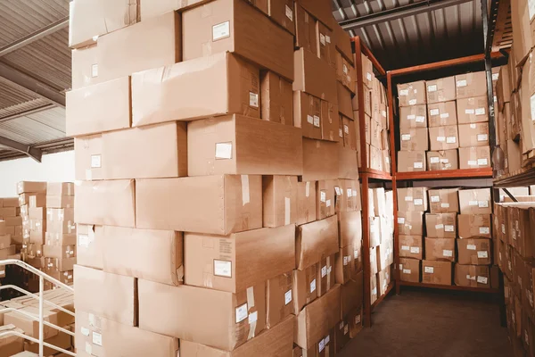 Shelves with boxes in warehouse — Stock Photo, Image