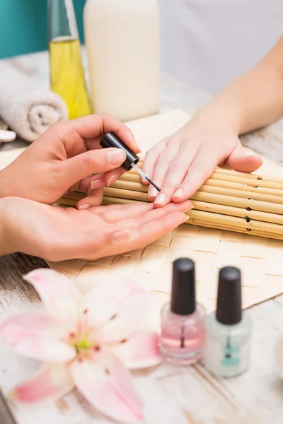 Nail technician giving custome manicure — Stock Photo, Image