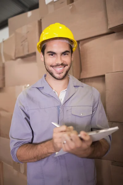 Worker clipboard in warehouse — Stock Photo, Image