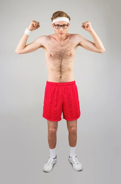 Shirtless hipster flexing biceps — Stock Photo, Image