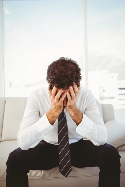 Businessman with head in hands — Stock Photo, Image