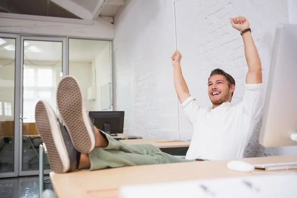 Businessman cheering in office — Stock Photo, Image