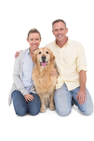 Couple sitting together with dog — Stock Photo, Image