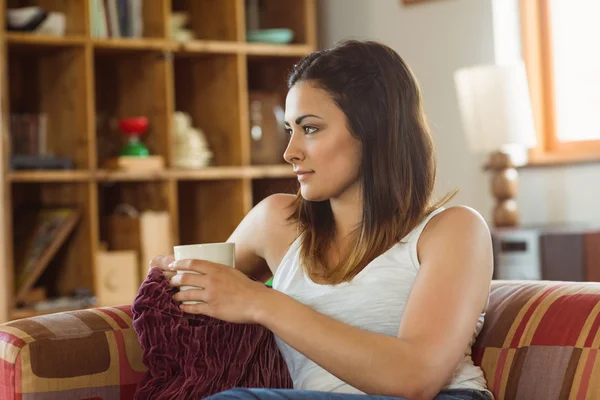 Woman relaxing on couch — Stock Photo, Image