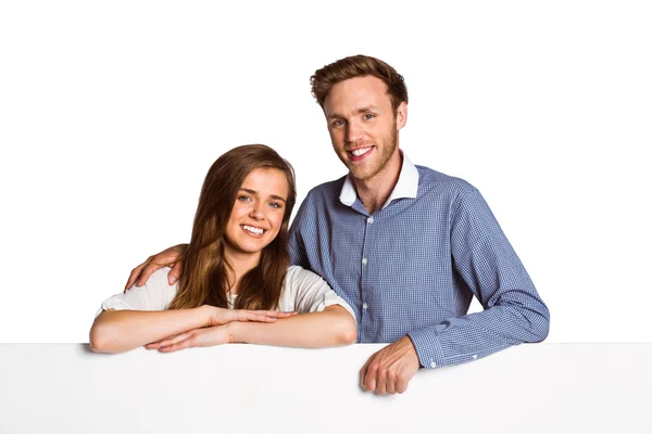 Couple with blank board — Stock Photo, Image