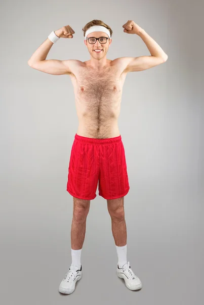 Shirtless hipster flexing biceps — Stock Photo, Image