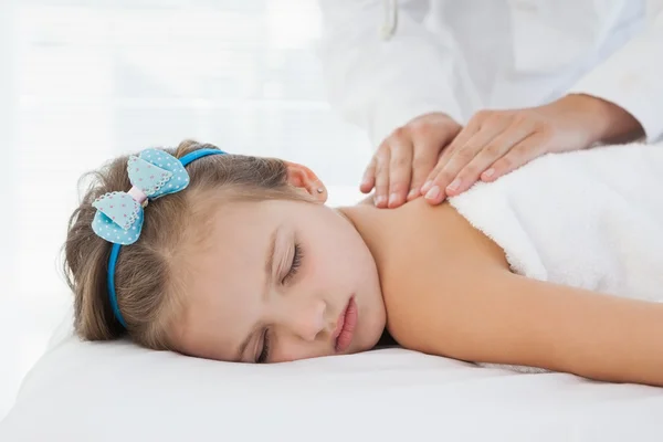 Girl lying on table — Stock Photo, Image