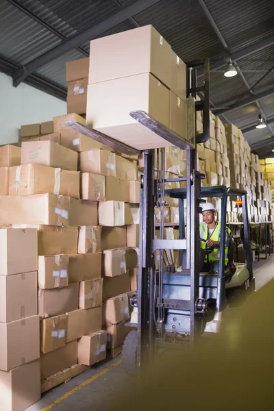 Forklift machine in warehouse — Stock Photo, Image