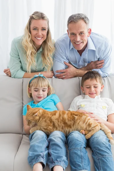 Family relaxing together on couch — Stock Photo, Image