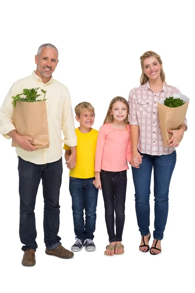 Familia con bolsas de comestibles — Foto de Stock