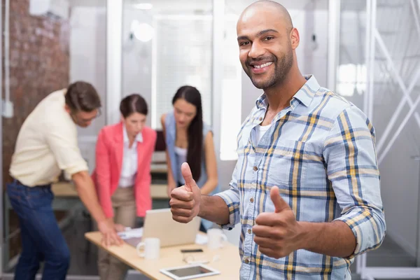 Businessman giving thumbs up — Stock Photo, Image