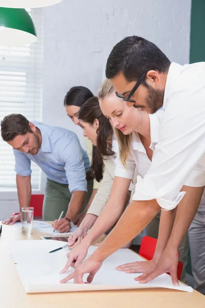 Architects going over blueprints — Stock Photo, Image