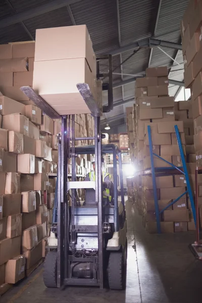 Forklift machine in warehouse — Stock Photo, Image