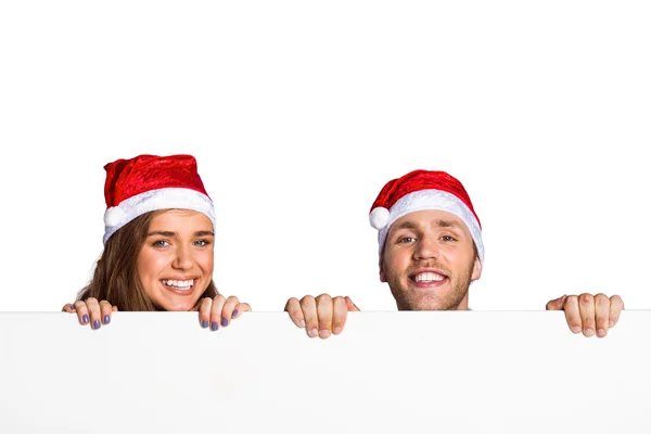 Pareja en sombreros de Santa — Foto de Stock