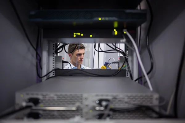 Technician using digital cable analyzer — Stock Photo, Image