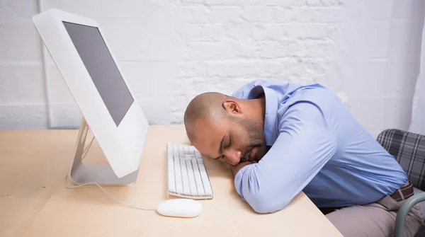 Businessman sleeping by computer — Stock Photo, Image