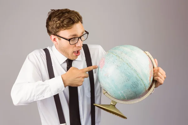 Businessman pointing to globe — Stock Photo, Image