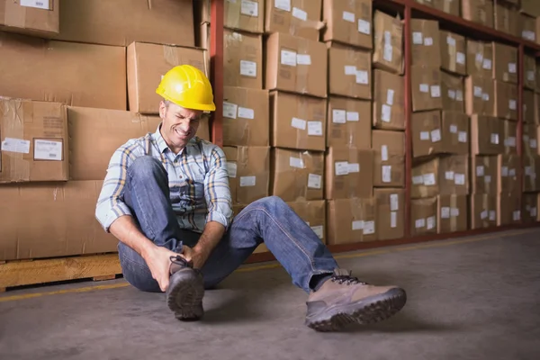 Worker with sprained ankle — Stock Photo, Image