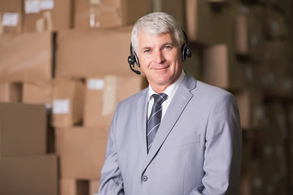 Businessman using headset — Stock Photo, Image