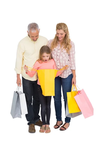 Parents and daughter with shopping bags — Stock Photo, Image