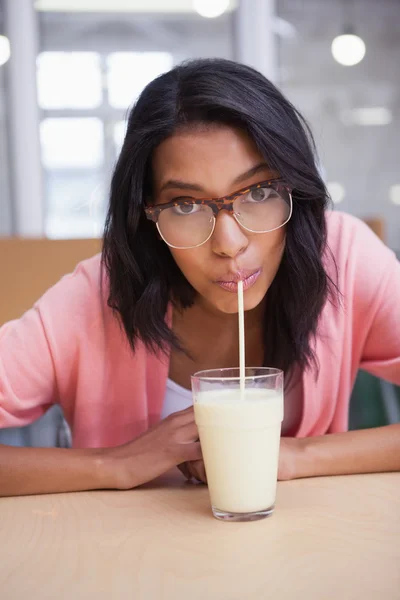 Businesswoman drinking glass of milk — Stock Photo, Image