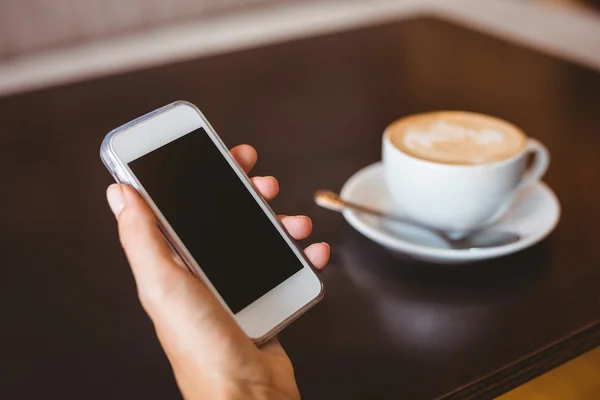 Hand of woman holding smartphone — Stock Photo, Image