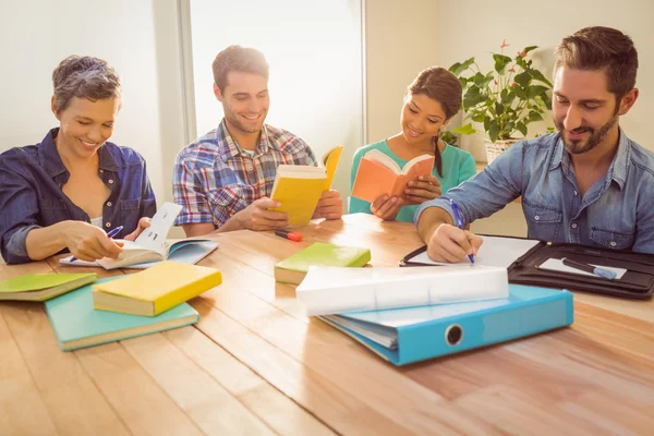 Group of colleagues reading books — Stock Photo, Image