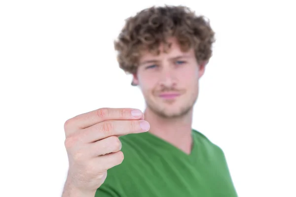 Gelukkig knappe man kijken naar zijn hand — Stockfoto