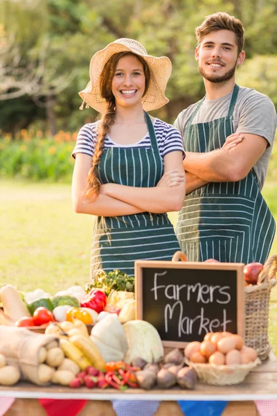 Happy farmers standing arms crossed — Stock Photo, Image