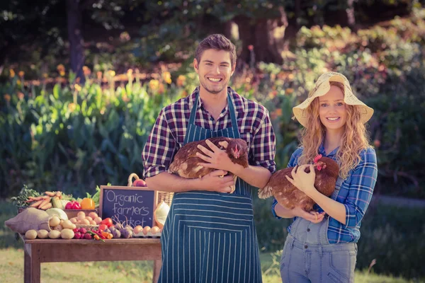 Farmers holding chickens — Stock Photo, Image