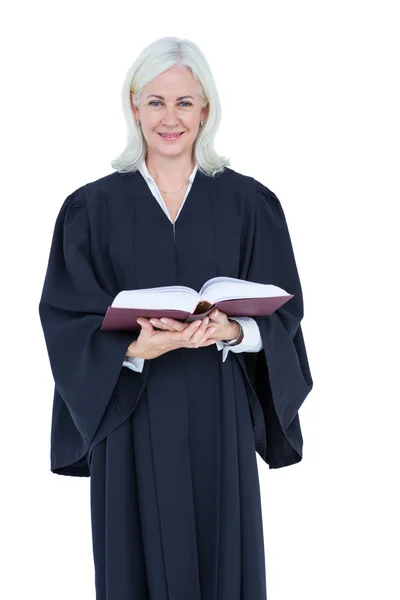 Happy lawyer holding law code — Stock Photo, Image