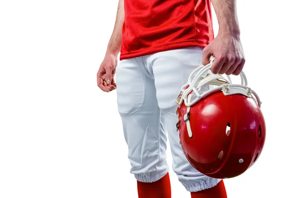 Giocatore di calcio prendendo il suo casco sulla sua mano — Foto Stock
