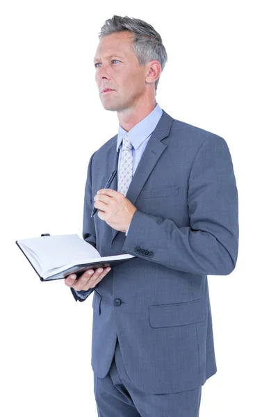 Homme d'affaires avec journal intime sur blanc — Photo