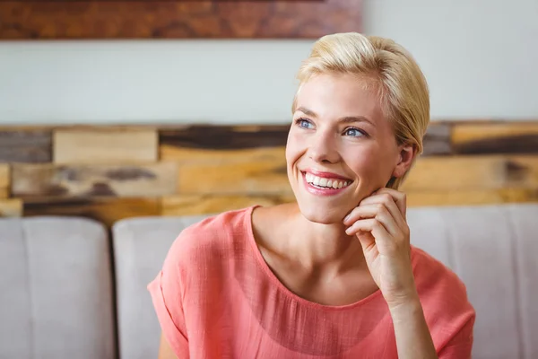 Pretty blonde holding cup of coffee — Stock Photo, Image