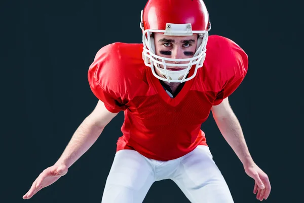 American football player taking his helmet — Stock Photo, Image