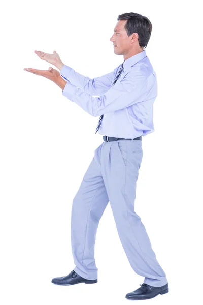 Businessman walking while gesturing with hands — Stock Photo, Image