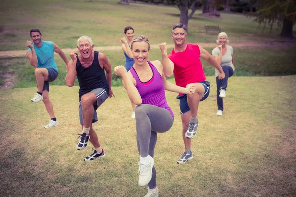 Happy athletic group training — Stock Photo, Image