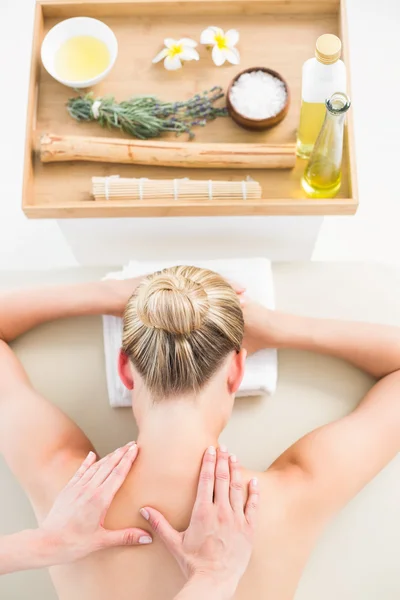 Blonde enjoying herbal compress massage — Stock Photo, Image