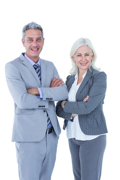 Businesswoman and man with arms crossed Stock Photo
