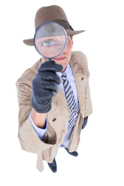 Spy looking through magnifier — Stock Photo, Image