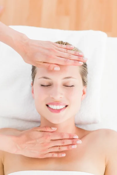 Calm woman receiving reiki treatment — Stock Photo, Image