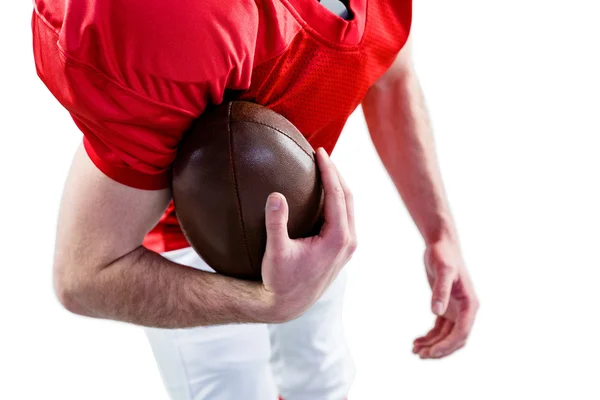 Football player taking a ball on her hand — Stock Photo, Image